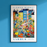 a blue wall with a poster of a flower market