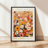 a flower market poster hanging on a wall