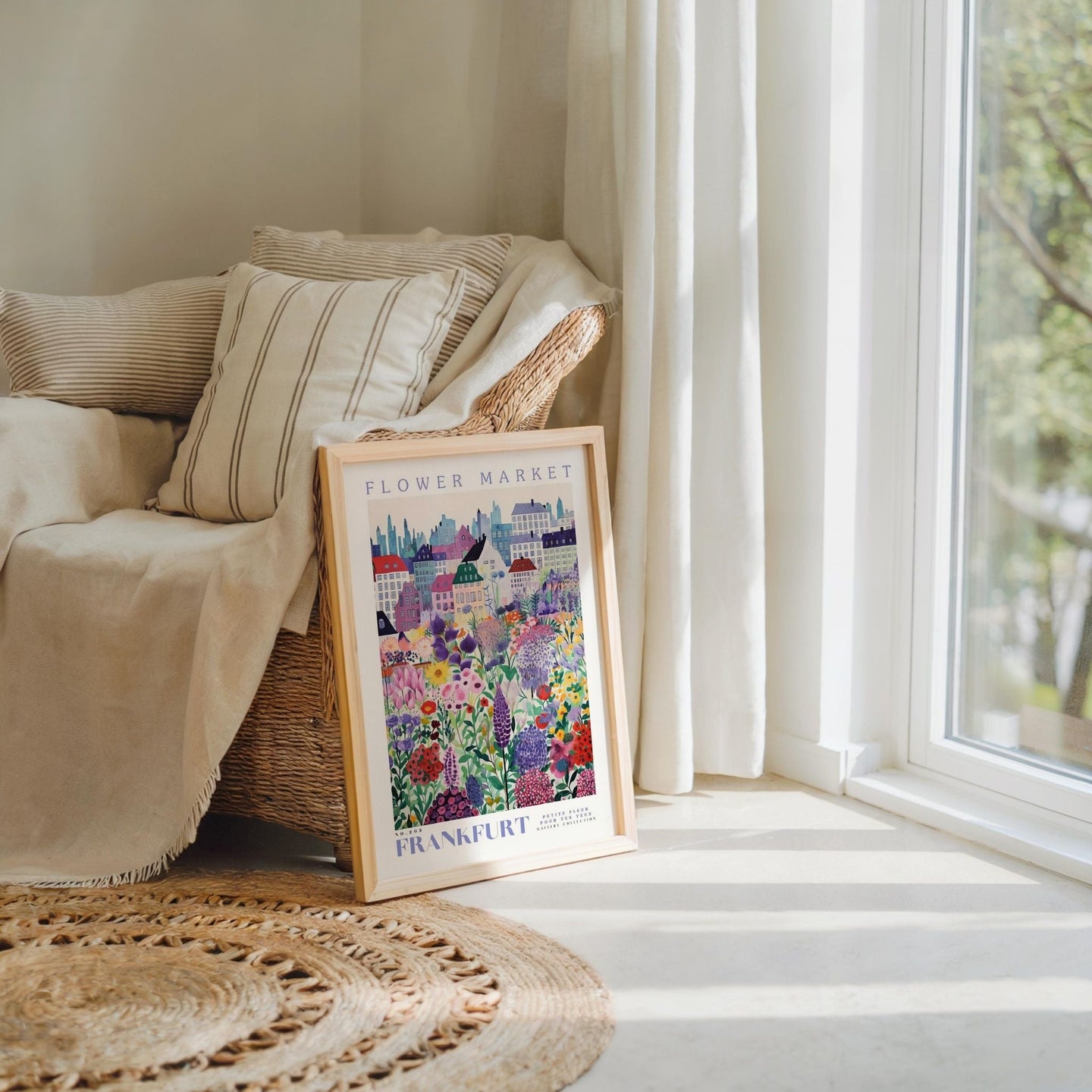 a picture frame sitting on a rug next to a window