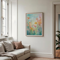 a living room with a couch and a painting on the wall