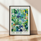 a flower market poster hanging on a wall