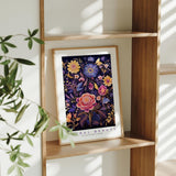 a picture of a painting of flowers on a shelf