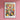 a flower market poster hanging on a pink wall