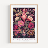 a framed print of flowers and leaves on a white wall