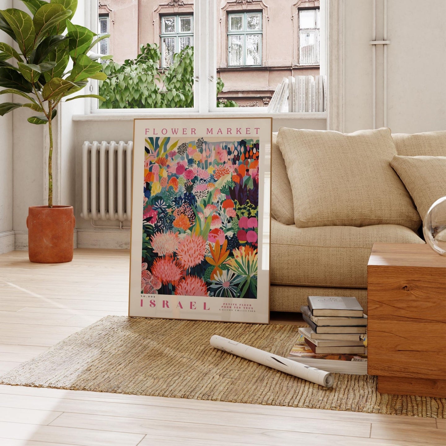 a living room with a couch and a poster on the floor