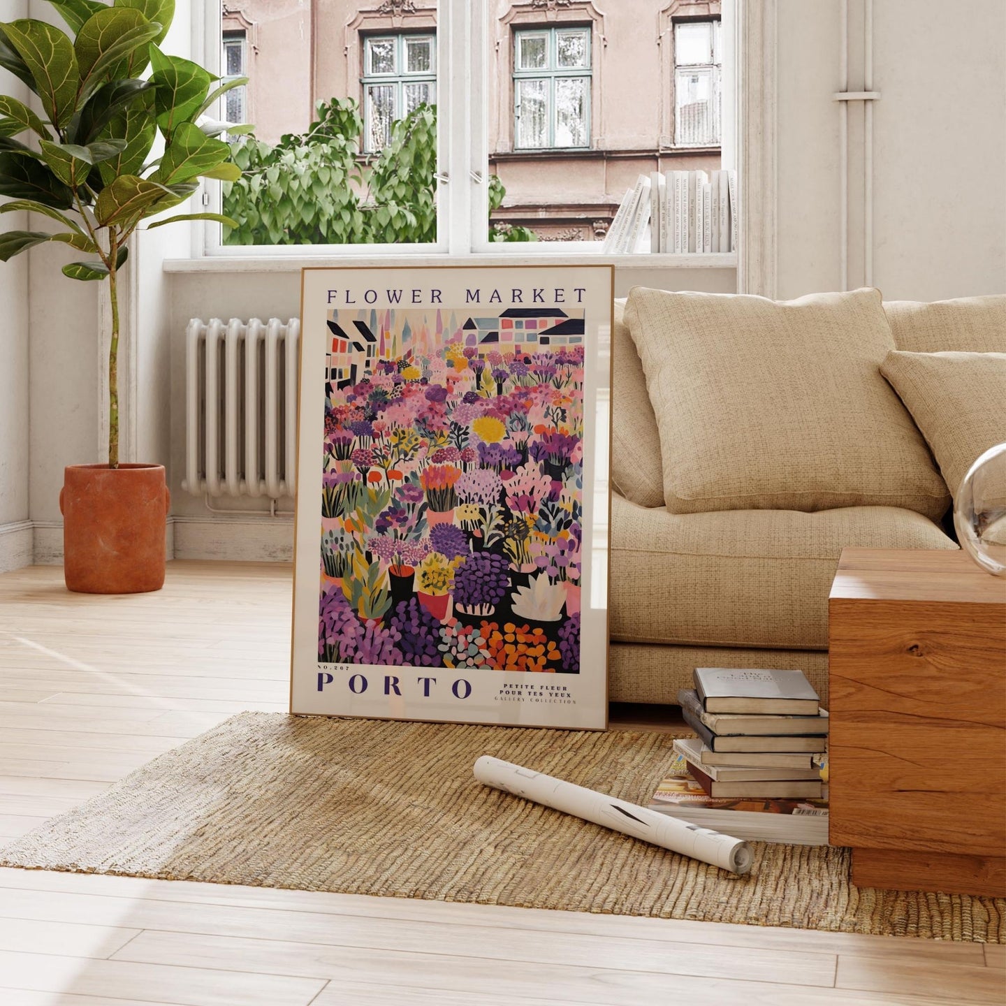 a living room with a couch and a poster on the floor