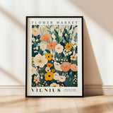 a picture of a flower market poster hanging on a wall