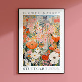 a pink wall with a picture of flowers on it