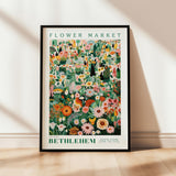 a picture of a flower market poster hanging on a wall