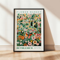 a picture of a flower market poster hanging on a wall