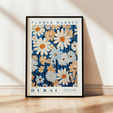 a flower market poster hanging on a wall