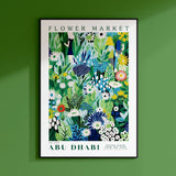 a green wall with a picture of flowers on it