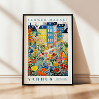 a picture of a flower market with a building in the background
