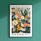 a flower market poster hanging on a wall