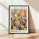 a flower market poster hanging on a wall
