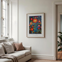 a living room with a couch and a painting on the wall
