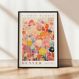 a flower market poster hanging on a wall
