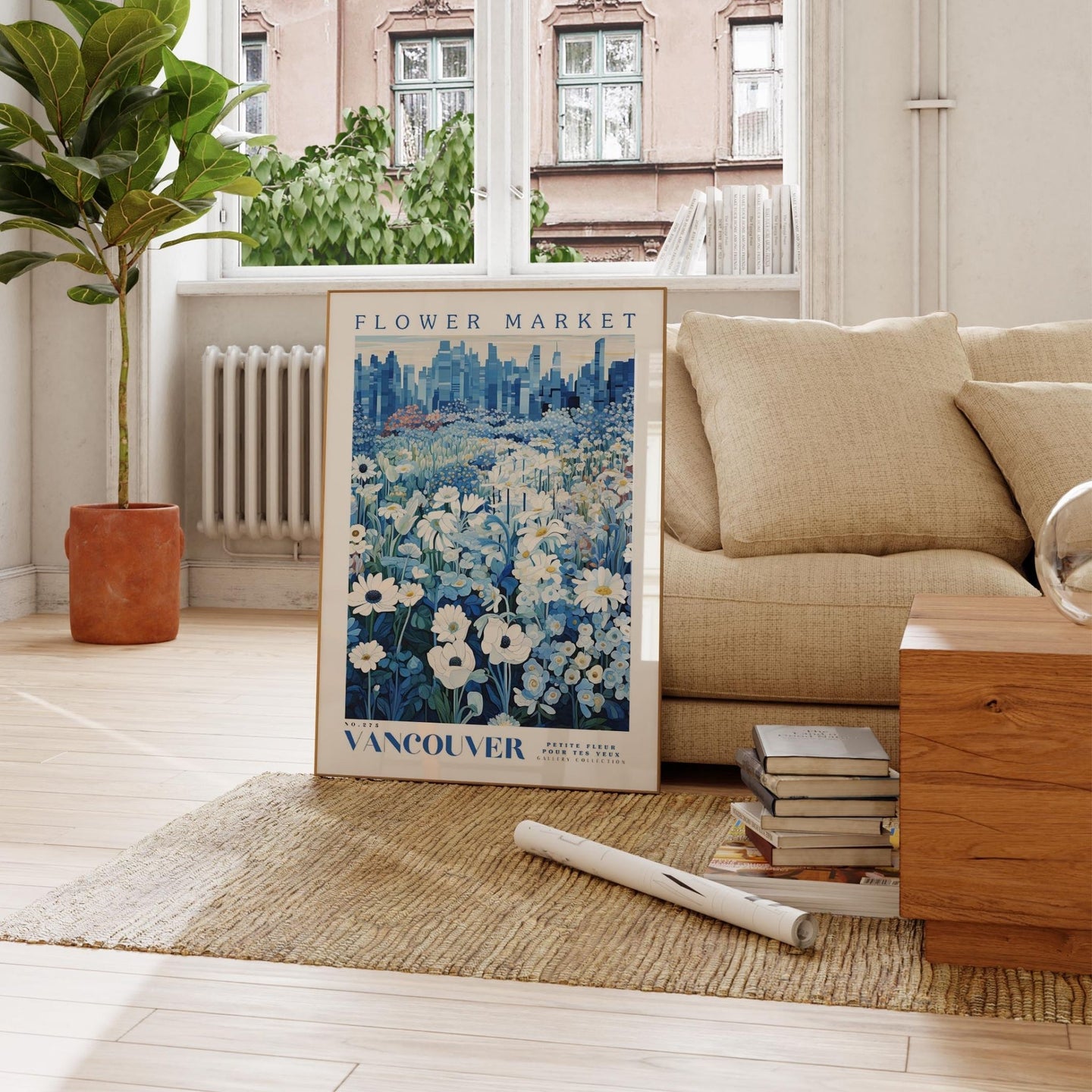 a living room with a couch and a poster on the floor