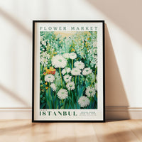 a picture of a flower market poster hanging on a wall