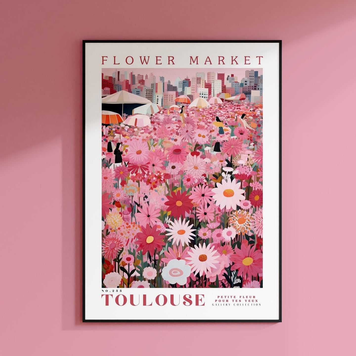 a pink flower market poster hangs on a pink wall
