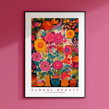 a pink wall with a picture of flowers in vases