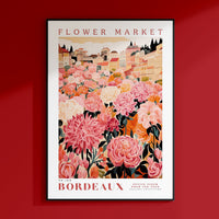 a red wall with a picture of a flower market
