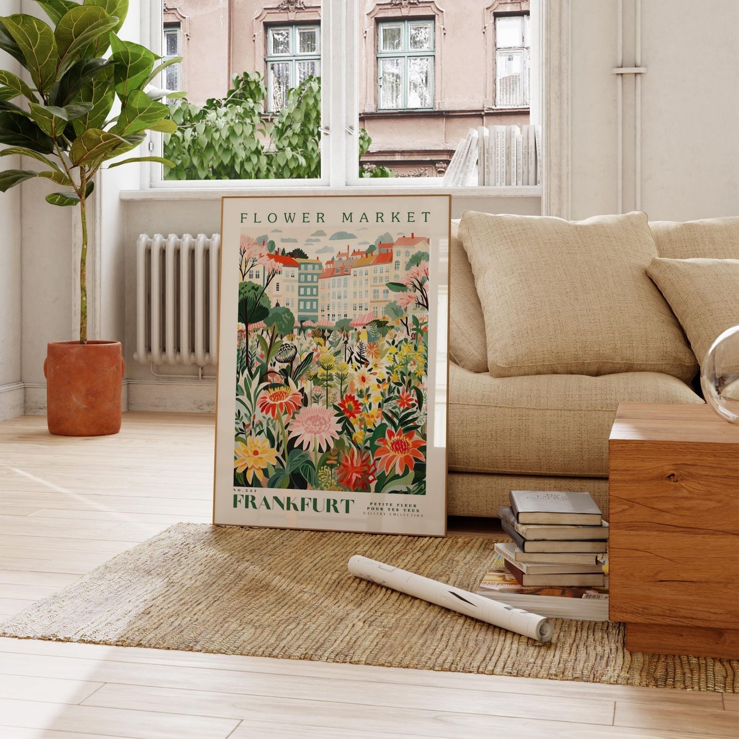 a living room with a couch and a poster on the floor