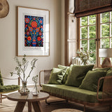 a living room filled with furniture and a painting on the wall