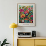 a painting of flowers on a wall above a radio