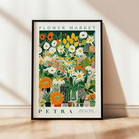 a picture of a flower market poster hanging on a wall
