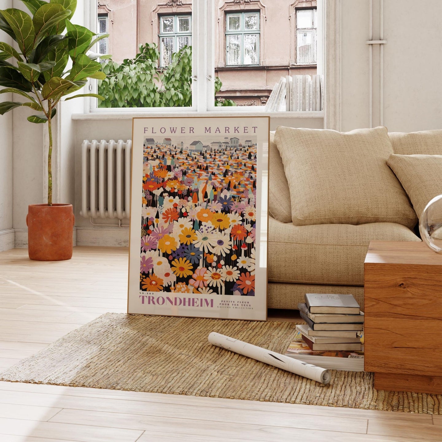 a living room with a couch and a poster on the floor