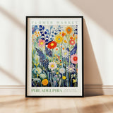 a picture of a flower market poster hanging on a wall