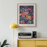 a picture of flowers on a wall above a radio