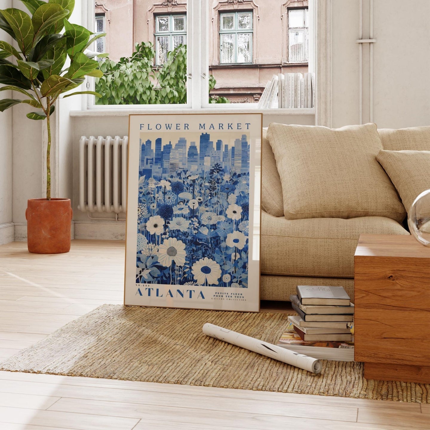 a living room with a couch and a poster on the floor