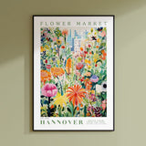 a flower market poster hanging on a wall