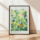 a picture of a flower market poster hanging on a wall