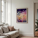 a living room with a couch and a painting on the wall