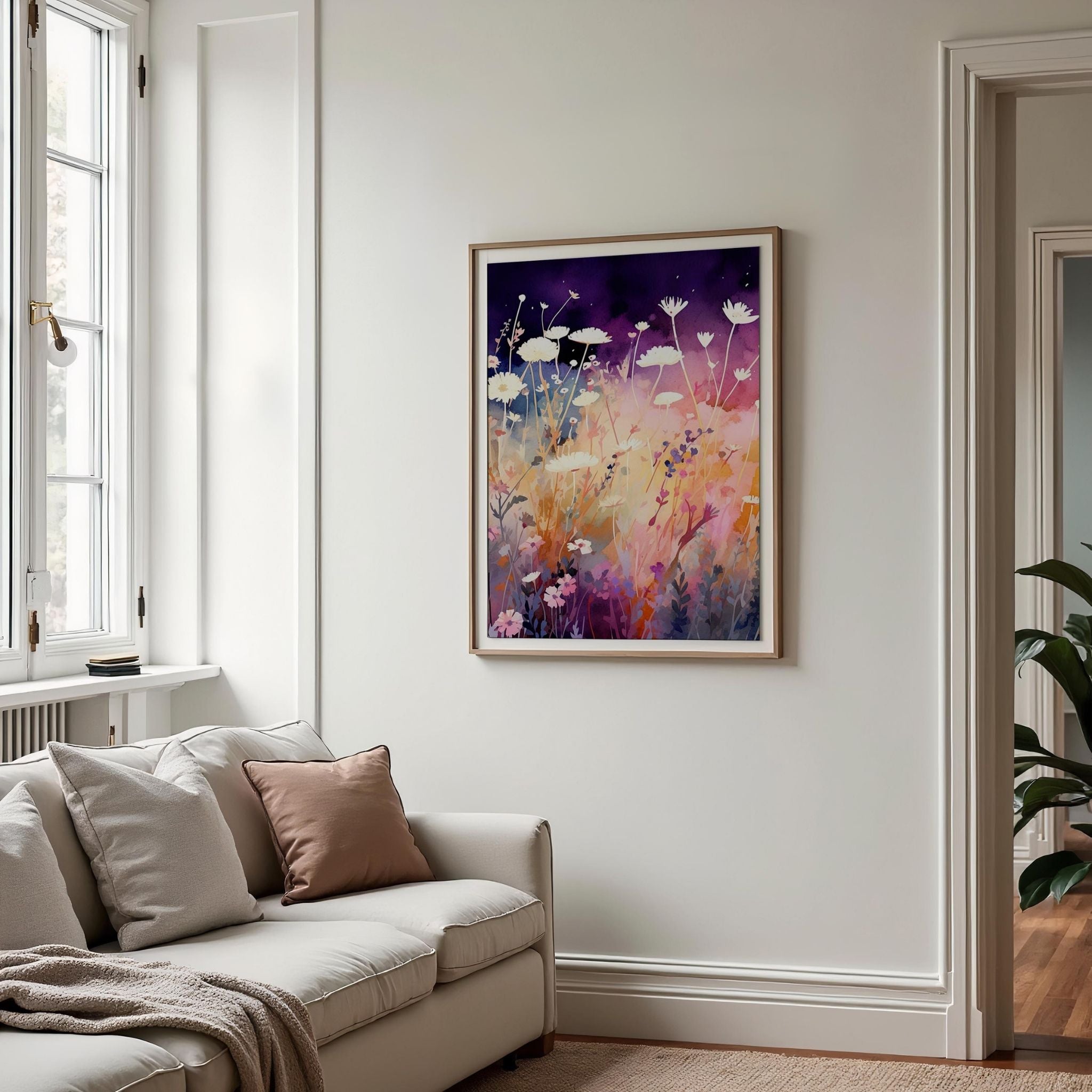 a living room with a couch and a painting on the wall