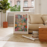 a living room with a couch and a painting on the floor