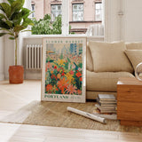 a living room with a couch and a poster on the floor