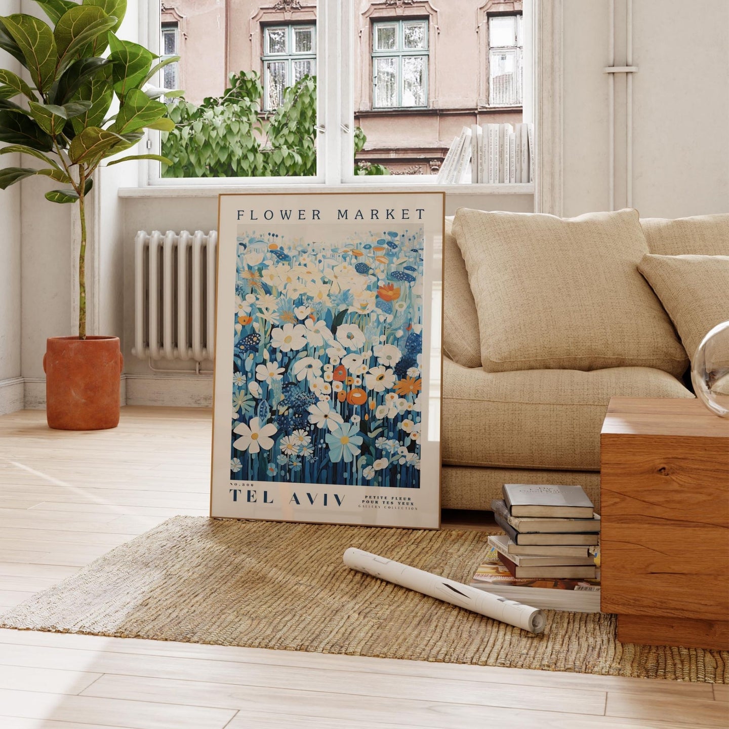 a living room with a couch and a poster on the floor