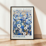 a picture of a flower market poster hanging on a wall