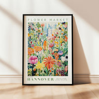 a flower market poster hanging on a wall