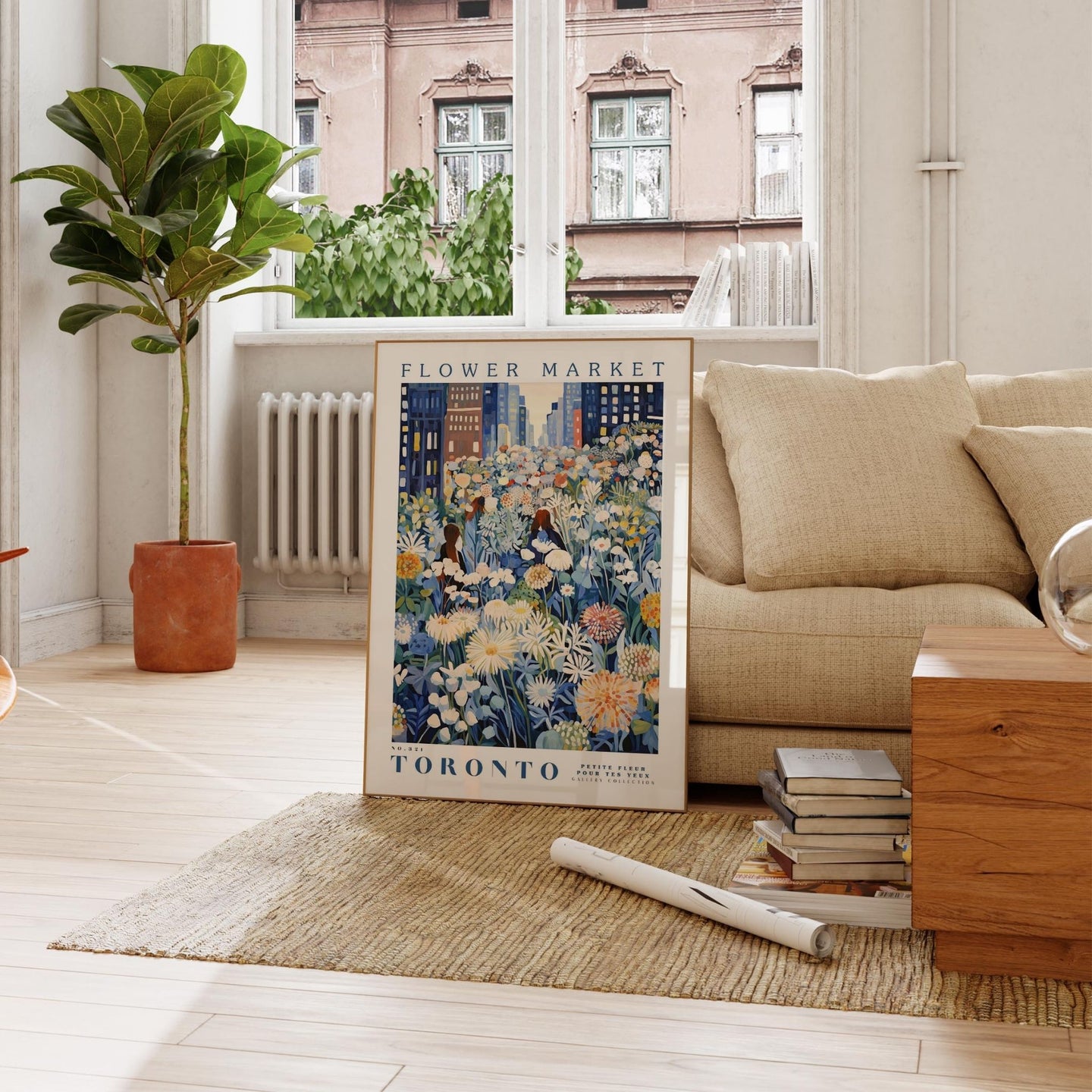 a living room with a couch and a painting on the floor