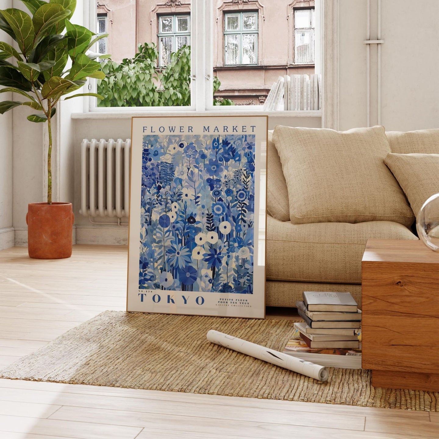 a living room with a couch and a poster on the floor